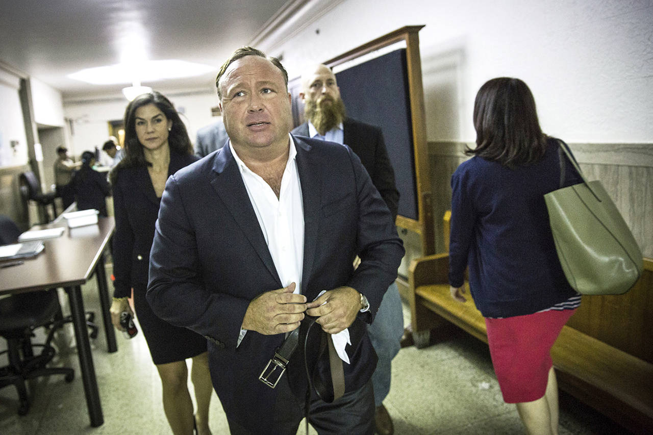 Right-wing conspiracy theorist and “Infowars” host Alex Jones arrives at the Travis County Courthouse in Austin, Texas, in April 2017. (Tamir Kalifa/Austin American-Statesman via AP, File)/Austin American-Statesman via AP)