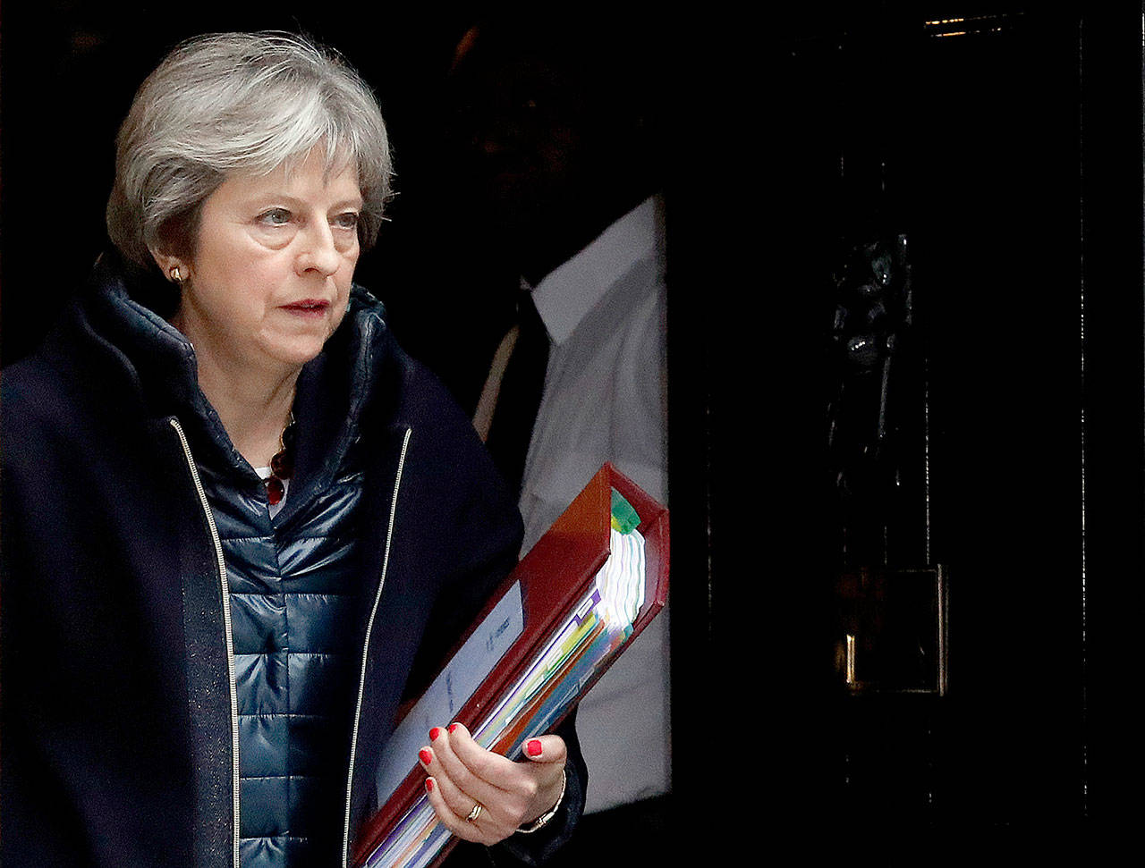 British Prime Minister Theresa May leaves 10 Downing Street to attend the weekly Prime Minister’s Questions session in parliament in London on Wednesday. (AP Photo/Frank Augstein)