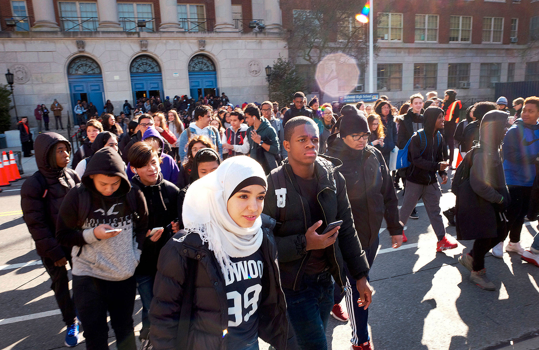 Hundreds of students walk out of Midwood High School in the New York burrough of Brooklyn as part of a nationwide protest against gun violence on Wednesday. (AP Photo/Mark Lennihan)