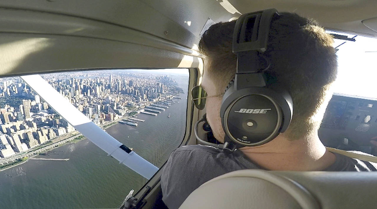 This 2017 image made from a video shows Aaron Ludomirski, certified flight instructor for Infinity Flight Group, flying over the Hudson River in New York. (AP Photo/Joshua Replogle)