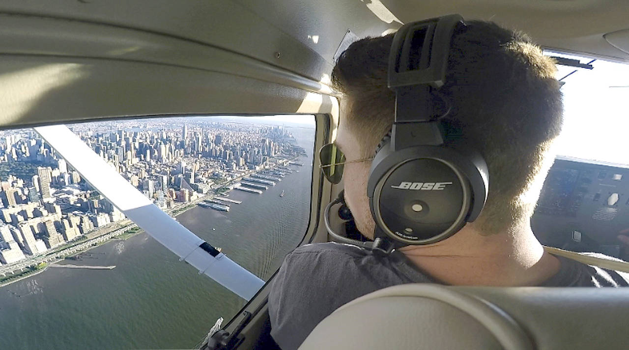 This 2017 image made from a video shows Aaron Ludomirski, certified flight instructor for Infinity Flight Group, flying over the Hudson River in New York. (AP Photo/Joshua Replogle)