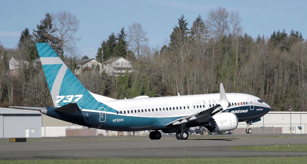 A Boeing 737 MAX 7 takes off on the model’s first flight on Friday in Renton. (AP Photo/Jason Redmond)
