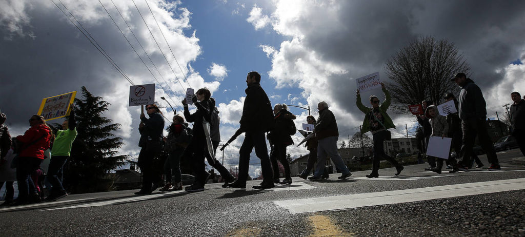 Protesters cross Lombard Avenue in downtown Everett during a March for Our Lives rally on Saturday. (Ian Terry / The Herald)
