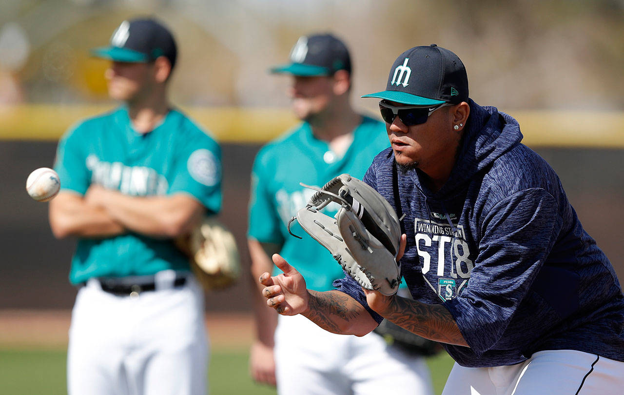 Mariners starting pitcher Felix Hernandez works out during spring training on Feb. 19, 2018, in Peoria, Ariz. (AP Photo/Charlie Neibergall)