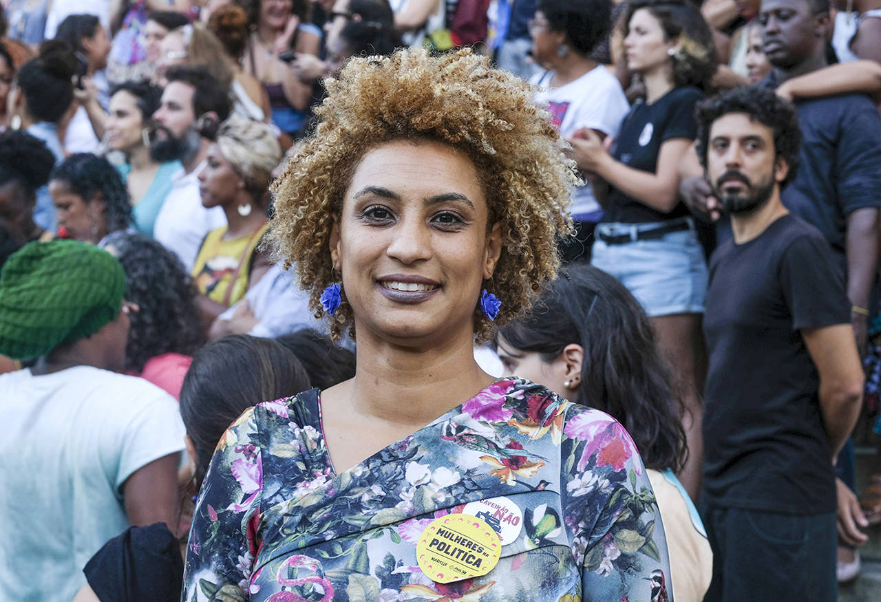 In this Jan. 9 photo, Councilwoman Marielle Franco smiles for a photo in Cinelandia square, in Rio de Janeiro, Brazil. Franco was slain March 14 while returning from an event focused on empowering young black women. (AP Photo/Ellis Rua)