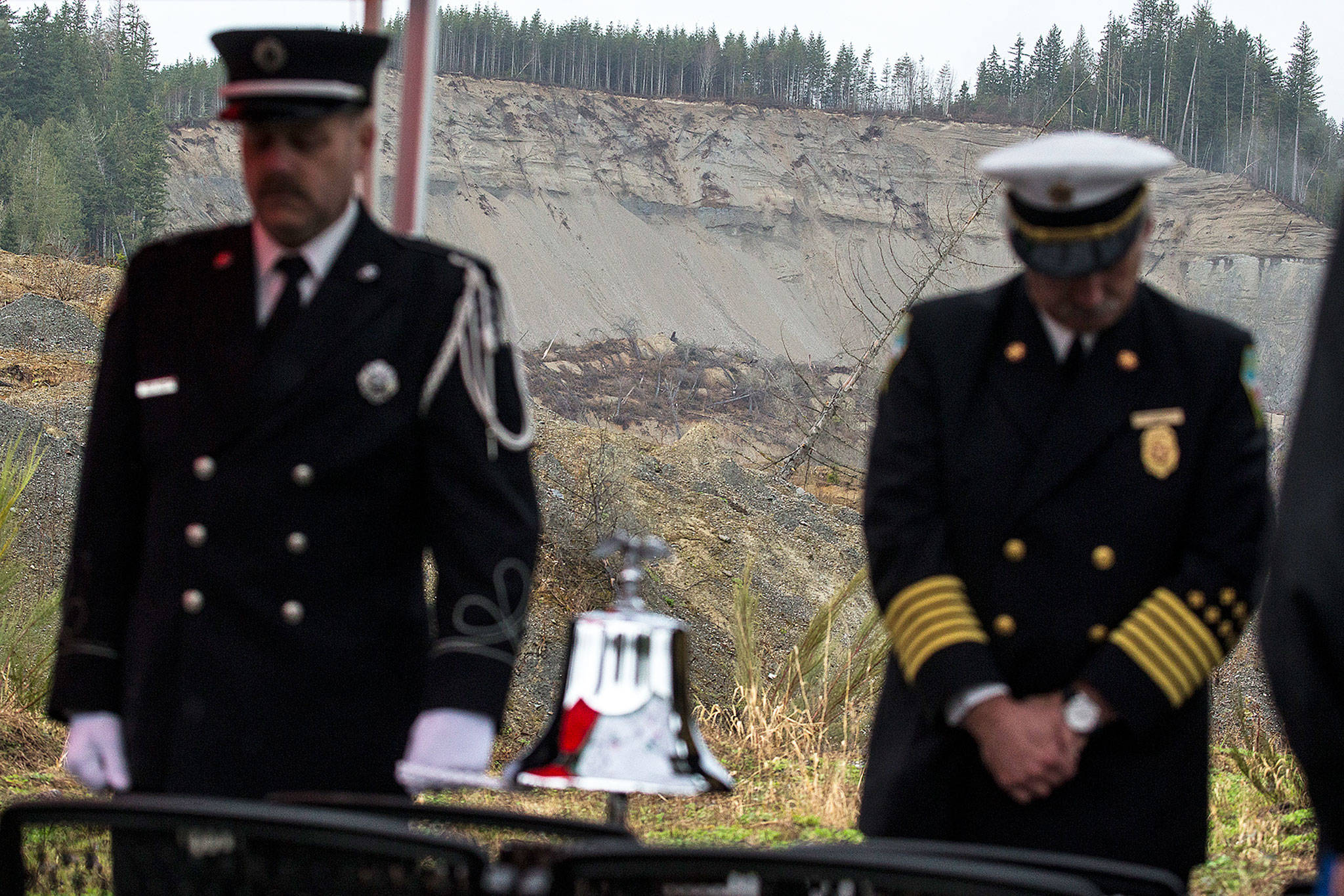 In view of the Oso mudslide, a bell ceremony is conducted during a gathering for family and friends of victims on Thursday to honor those killed in the March 22, 2014, tragedy. (Ian Terry / The Herald)