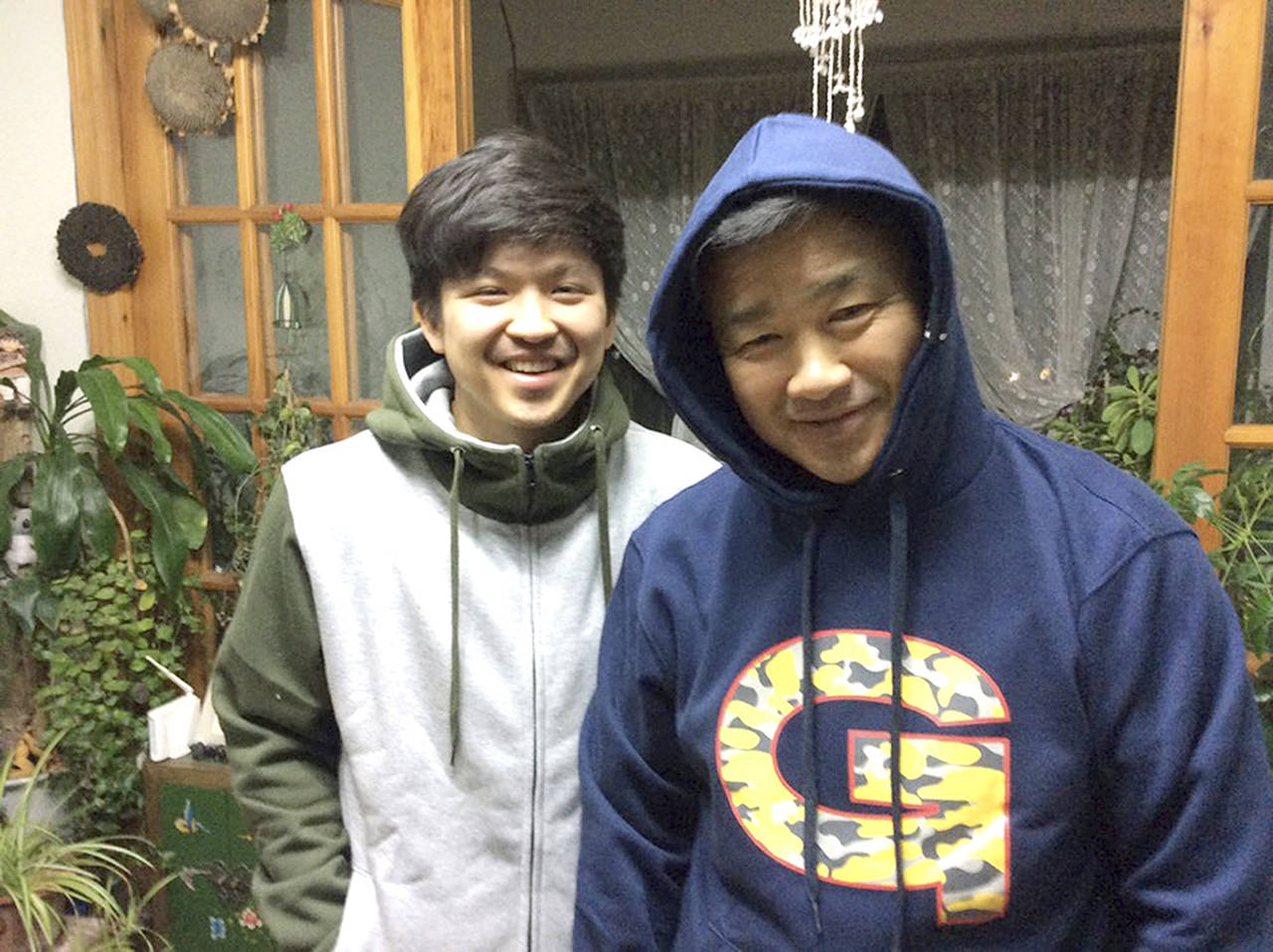 This photo shows Sol Kim (left) standing next to his father, Tony Kim, in 2016. Tony Kim Family via AP)
