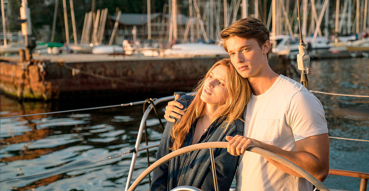 A girl with a hypersensitivity to sunlight (Bella Thorne) stares death in the face while in the arms of Patrick Schwarzenegger (son of Arnold, even more awkward on camera) in “Midnight Sun.” (Open Road Films)