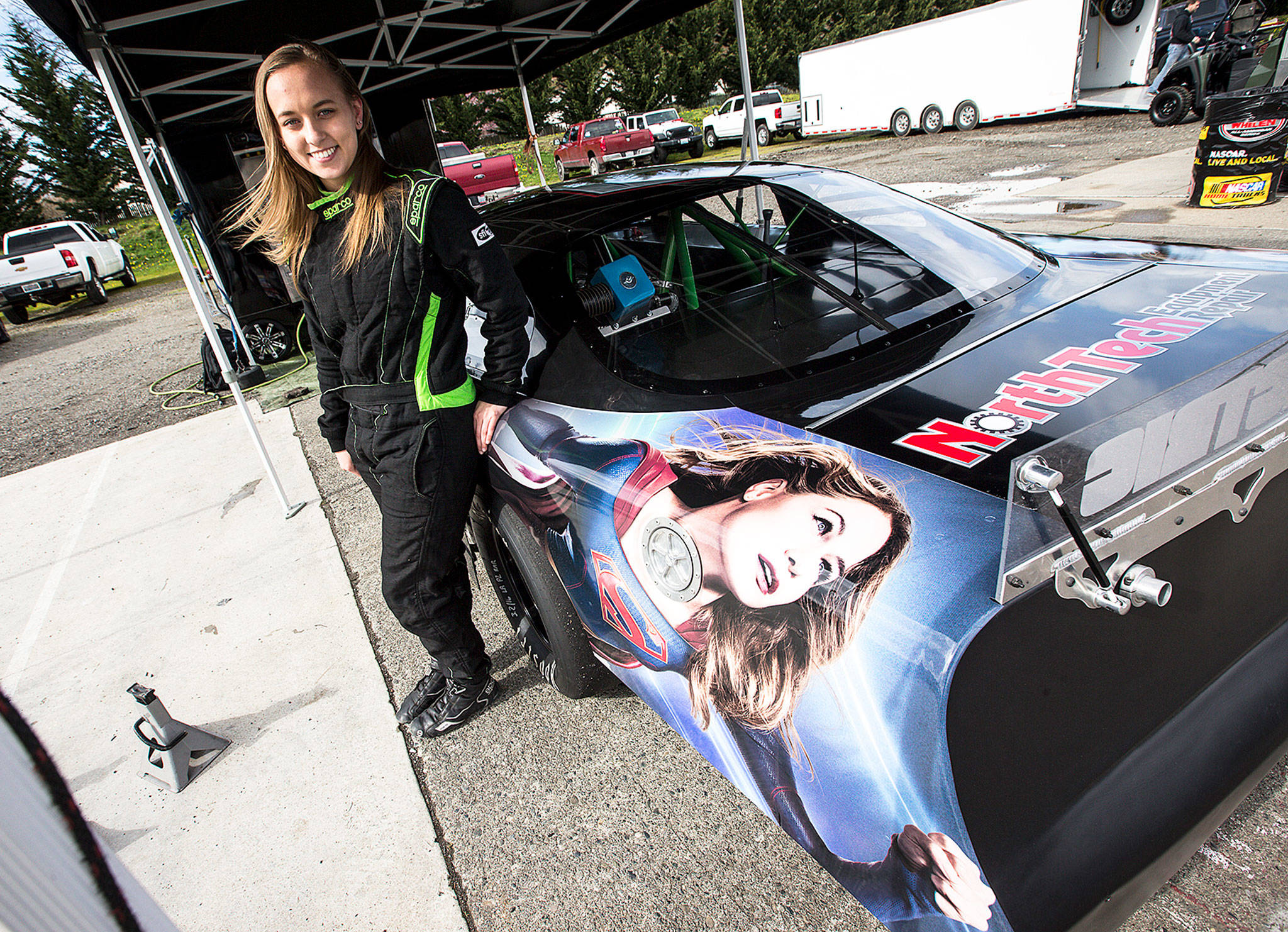 Brittney Zamora stands next to her “Supergirl” Super Late Model race car at the Evergreen Speedway. (Ian Terry / The Herald)