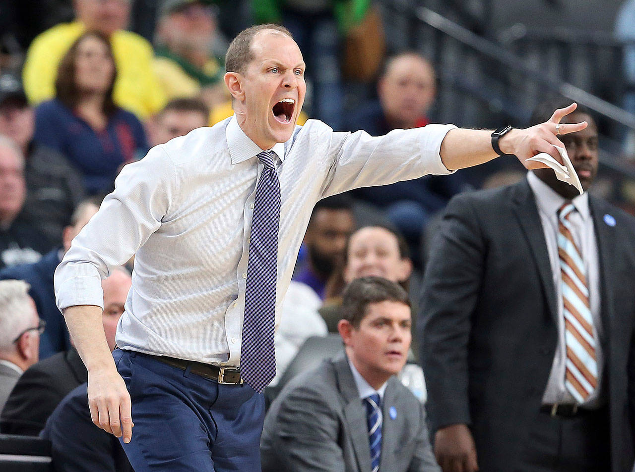 Washington coach Mike Hopkins yells to his team during a loss to Oregon State in the Pac-12 tournament on March 7 in Las Vegas. Hopkins reasserted his commitment to the Huskies on Thursday despite rumors of interest in him from Pittsburgh. (AP Photo/Isaac Brekken)