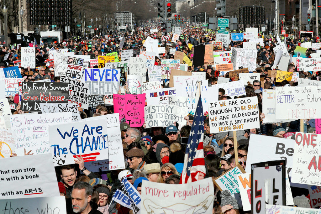 Crowds of people hold signs on Pennsylvania Avenue at the March for Our Lives rally in support of gun control on Saturday in Washington, D.C. (AP Photo/Alex Brandon)
