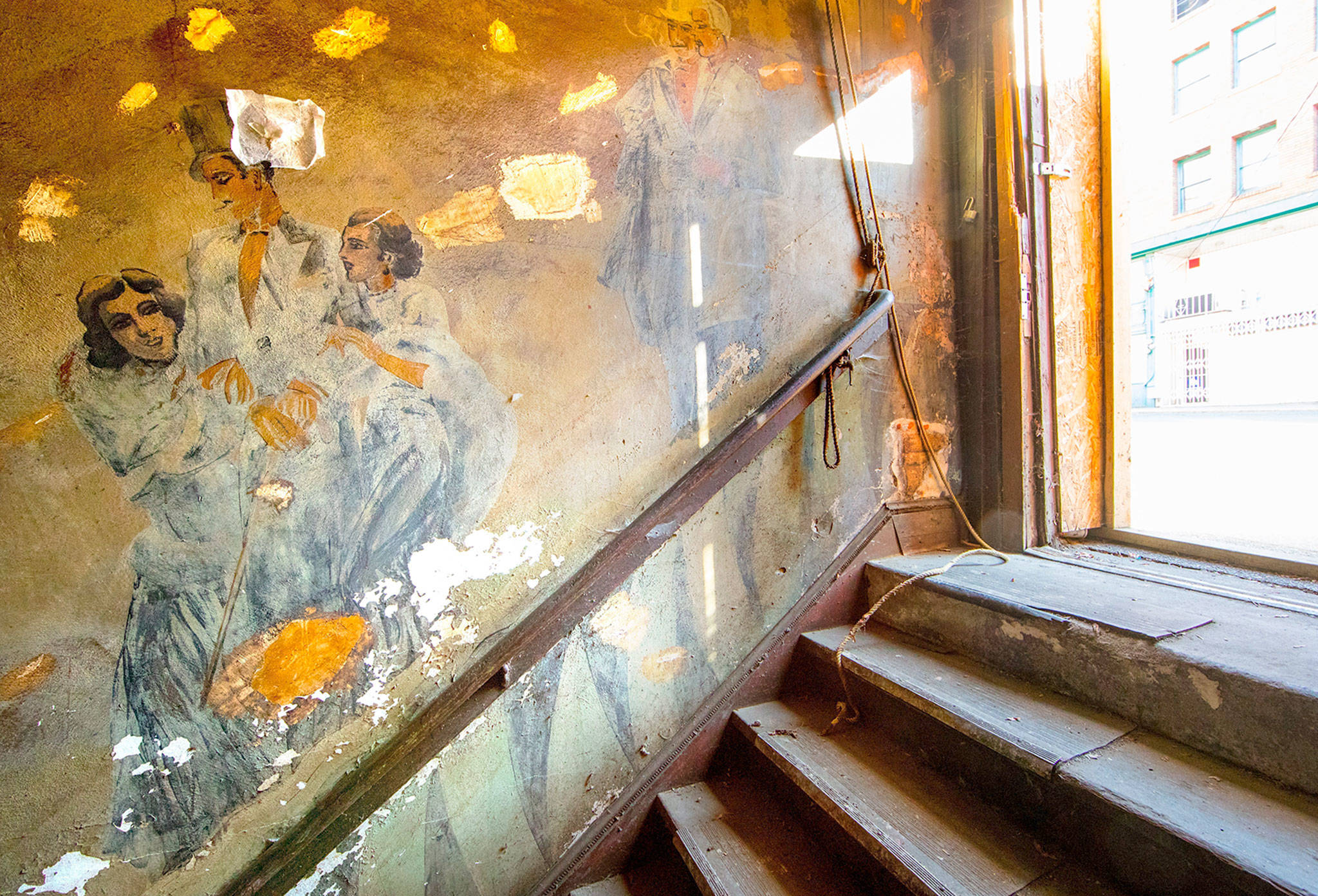 Prohibition-era murals were discovered during the renovation of the Louisa Hotel on South King Street in the International District of Seattle. (Mike Siegel/The Seattle Times via AP)