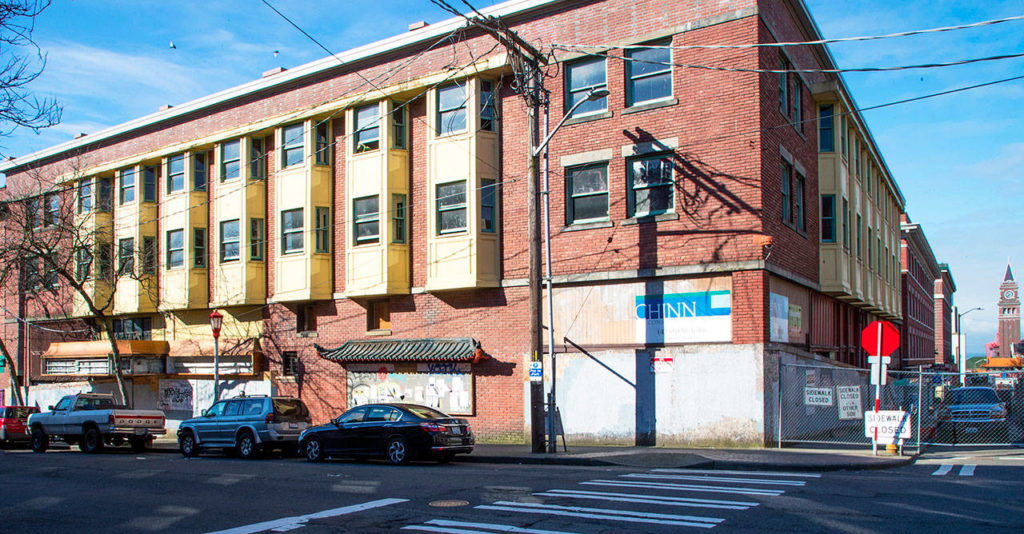 The old Louisa Hotel on South King Street in the International District of Seattle. The building was once where Chinese, Japanese and Filipino immigrants would stay before being shipped off to Alaska to work in fish canneries. (Mike Siegel/The Seattle Times via AP)
