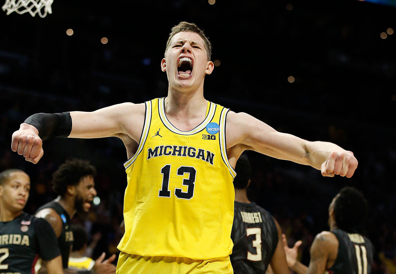 Michigan forward Moritz Wagner celebrates after scoring during the second half against Florida State in an NCAA Tournament regional final on March 24, 2018, in Los Angeles. (AP Photo/Alex Gallardo)