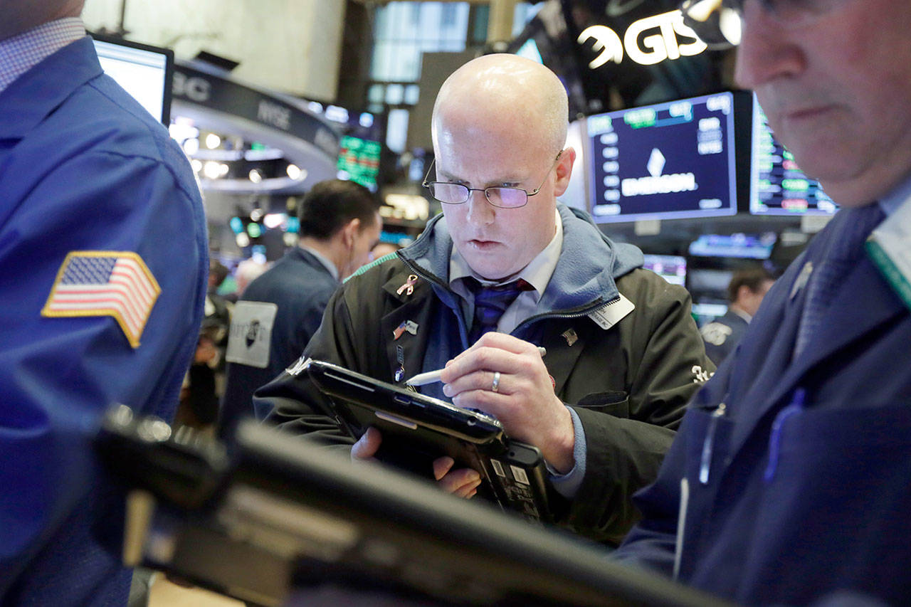 Trader Kevin Walsh works on the floor of the New York Stock Exchange on Monday. U.S. stocks rose sharply in early trading as the market made up some of its huge losses from last week. (AP Photo/Richard Drew)