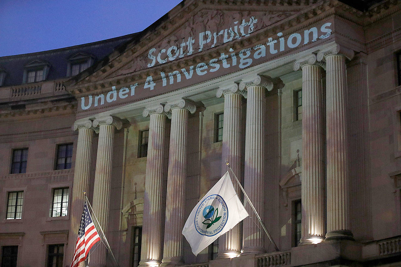 Light is projected by the League of Conservation Voters as part of the new Boot Pruitt campaign onto the Ronald Reagan Building and International Trade Center, the location of the Environmental Protection Agency, on Wednesday in Washington. (AP Photo/Alex Brandon)