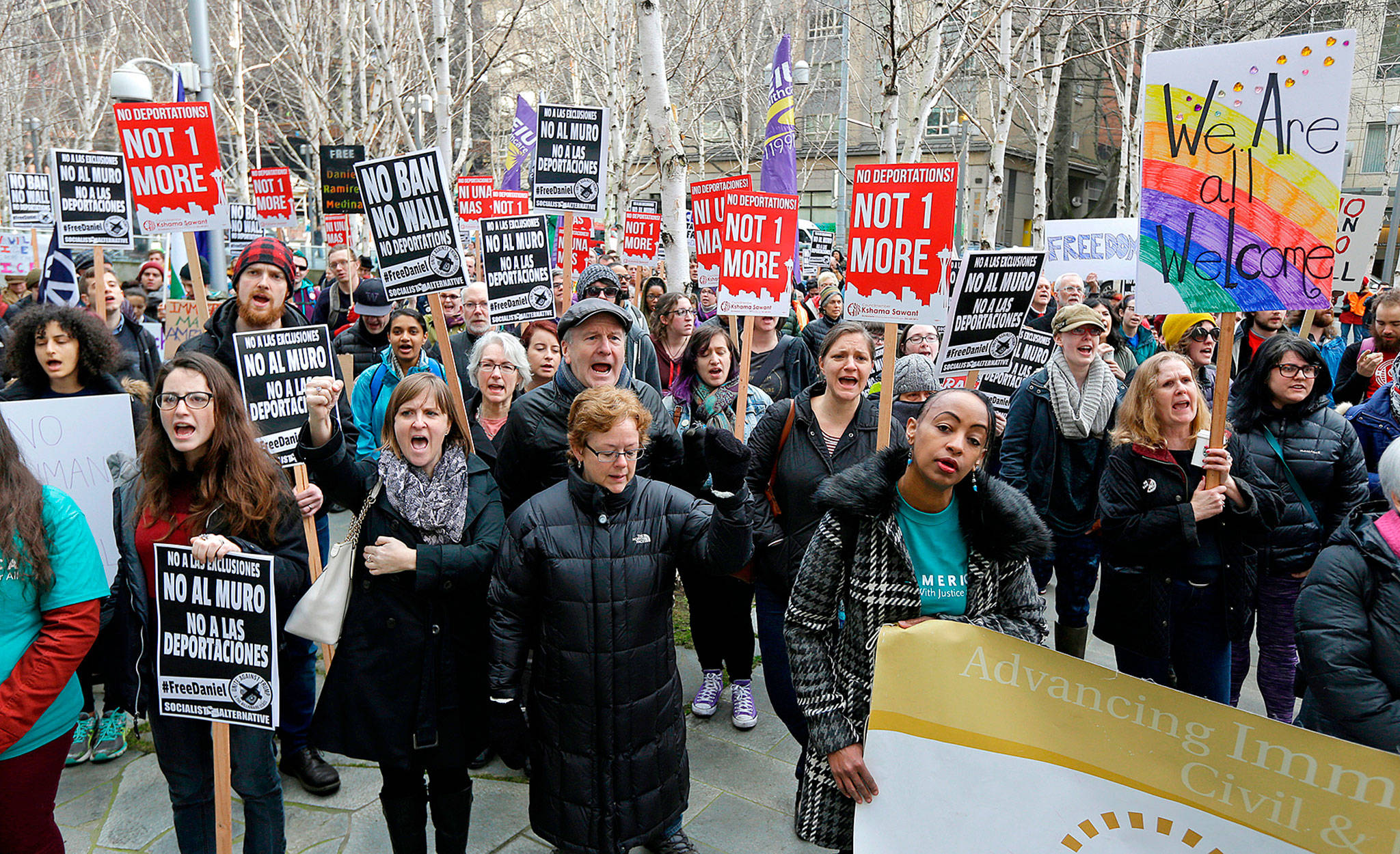 Protesters during a demonstration last year outside the federal courthouse in Seattle, where a hearing was held for a Seattle-area man who was arrested by immigration agents. A federal judge in Seattle has opened the door for thousands of immigrants to apply for asylum, finding that the Department of Homeland Security has routinely failed to notify them of a deadline for filing. (AP Photo/Ted S. Warren,File)