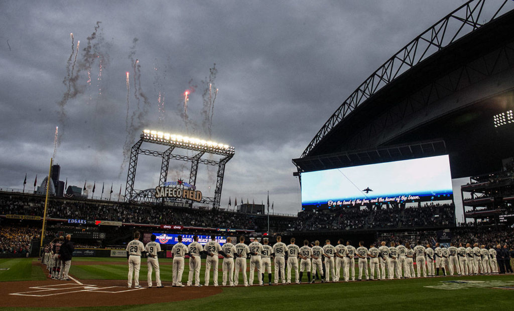 The opening ceremonies for the Mariners’ home opener are performed Thursday at Safeco Field. (Kevin Clark / The Herald)
