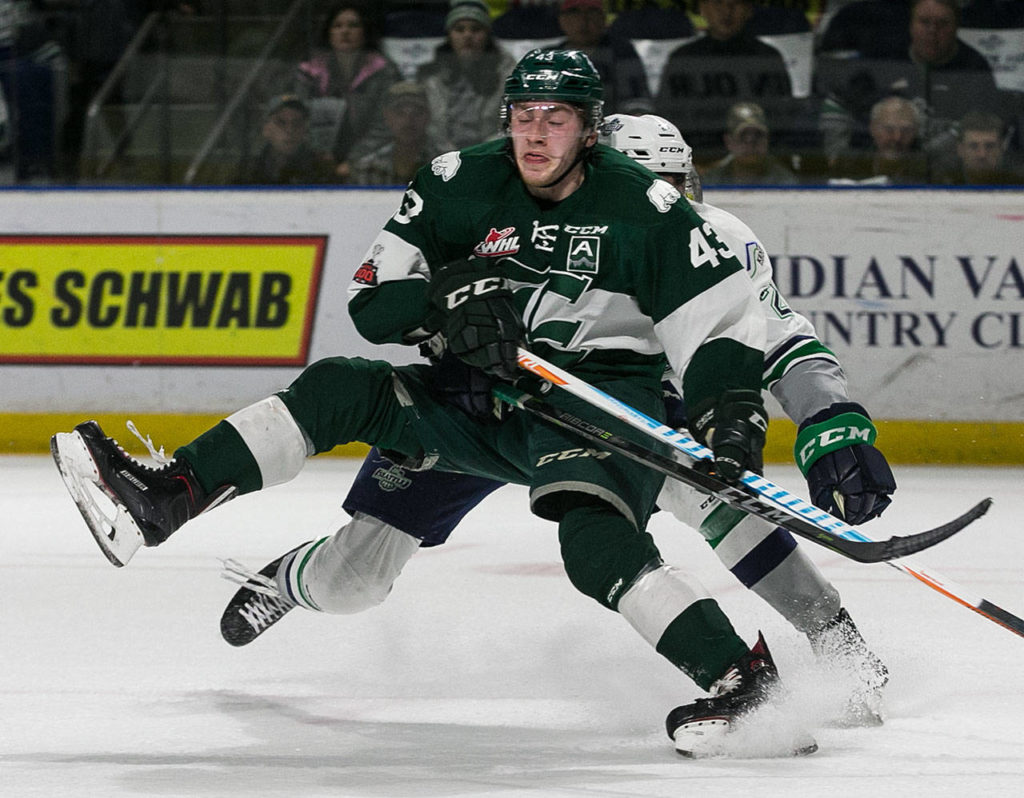 Everett’s Connor Dewar is fouled by Seattle’s Matthew Wedman on Friday at ShoWare Center in Kent. (Kevin Clark / The Daily Herald)
