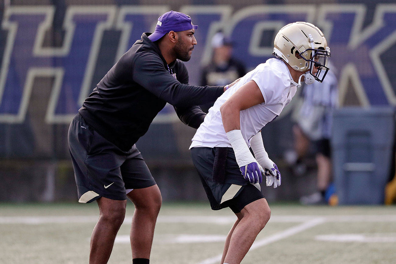 New assistant DBs coach Harris took long road to UW