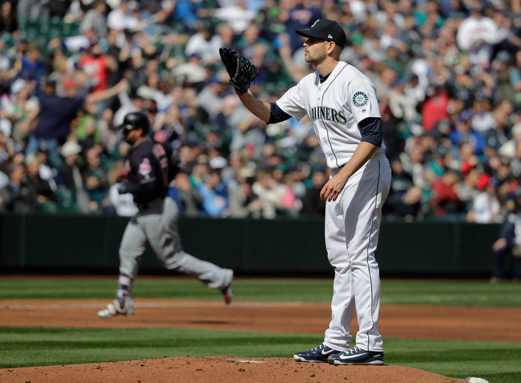 Mariners starting pitcher James Paxton (right) stands on the mound as the Indians’ Yonder Alonso rounds the bases after homering in the first inning on March 31, 2018, in Seattle. (AP Photo/Ted S. Warren)
