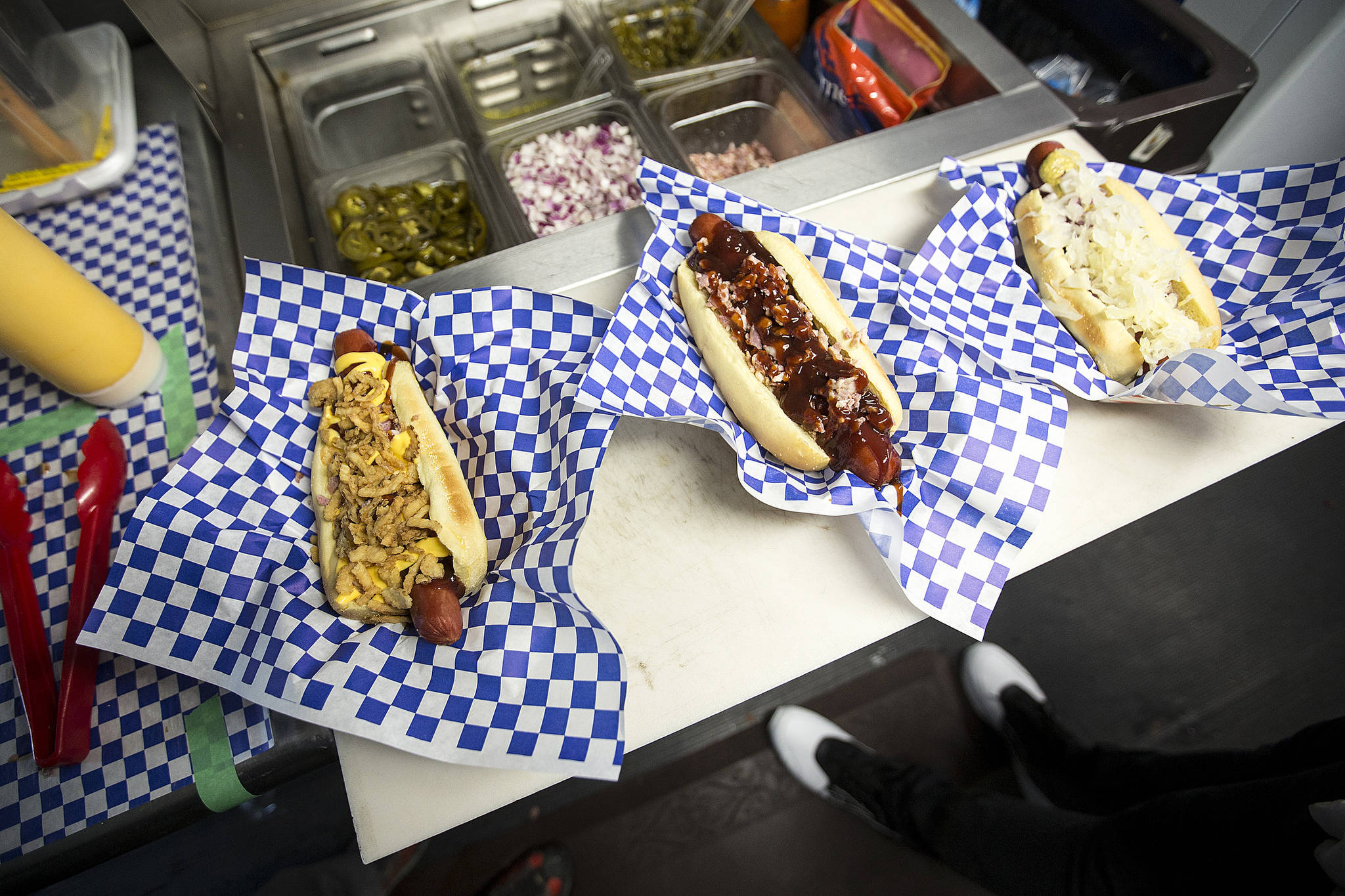 Hot dogs from Big Dog’s food truck — (from left) the Wilson, the LOB and the Petey — all have Seahawks inspired names. (Ian Terry / The Herald)