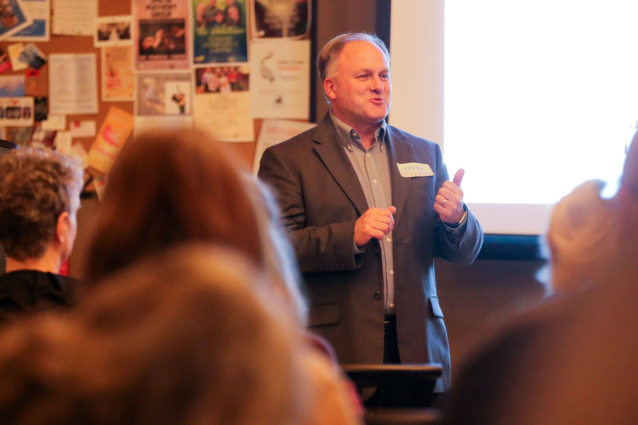 Steve Schuller, Snohomish’s interim city administrator, addresses a meeting of Snohomish Building Bridges at Looking Glass Coffee in Snohomish on Feb. 1. (Kevin Clark / The Herald)