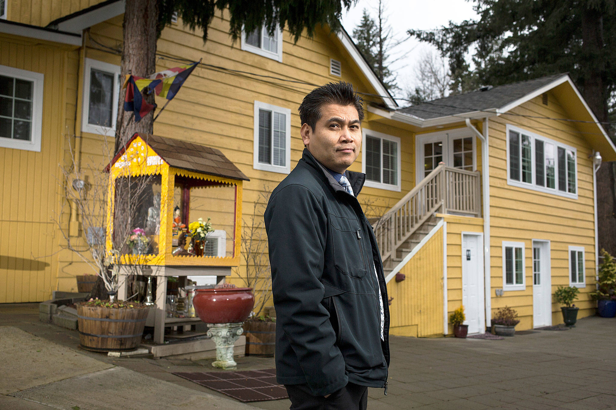 Titonath Dith is shown outside the Cambodian Buddhist Society-Wat Sanghikaram on Feb. 2 in Mill Creek. He is a son of Dith Pran, a survivor of the Cambodian genocide and one of the protagonists of the movie, “The Killing Fields.” Titonath Dith, who lives in Lynnwood, has helped start a foundation in his late father’s honor to provide scholarships to Cambodian youth. (Andy Bronson / The Herald)