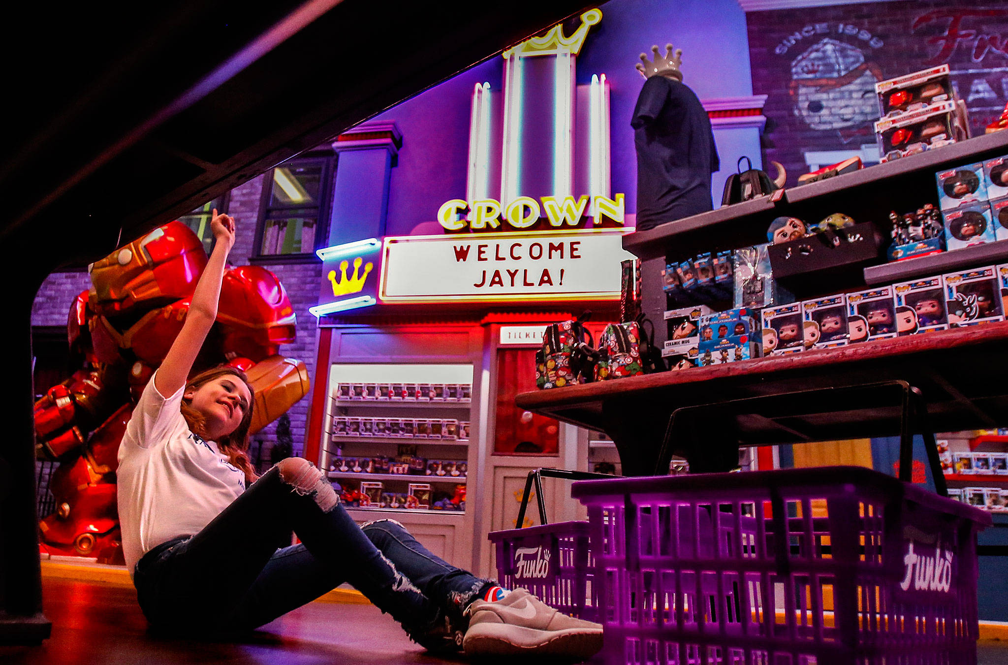 Make-A-Wish kid Jayla Kemp, 11, from Fulton, Missouri, celebrates for a moment before she chooses as much as she wishes Wednesday at Funko in Everett. The “Welcome Jayla” sign is for her, and Make-A-Wish Foundation really did make it happen for this preteen who suffers from cystic fibrosis. (Dan Bates / The Herald)