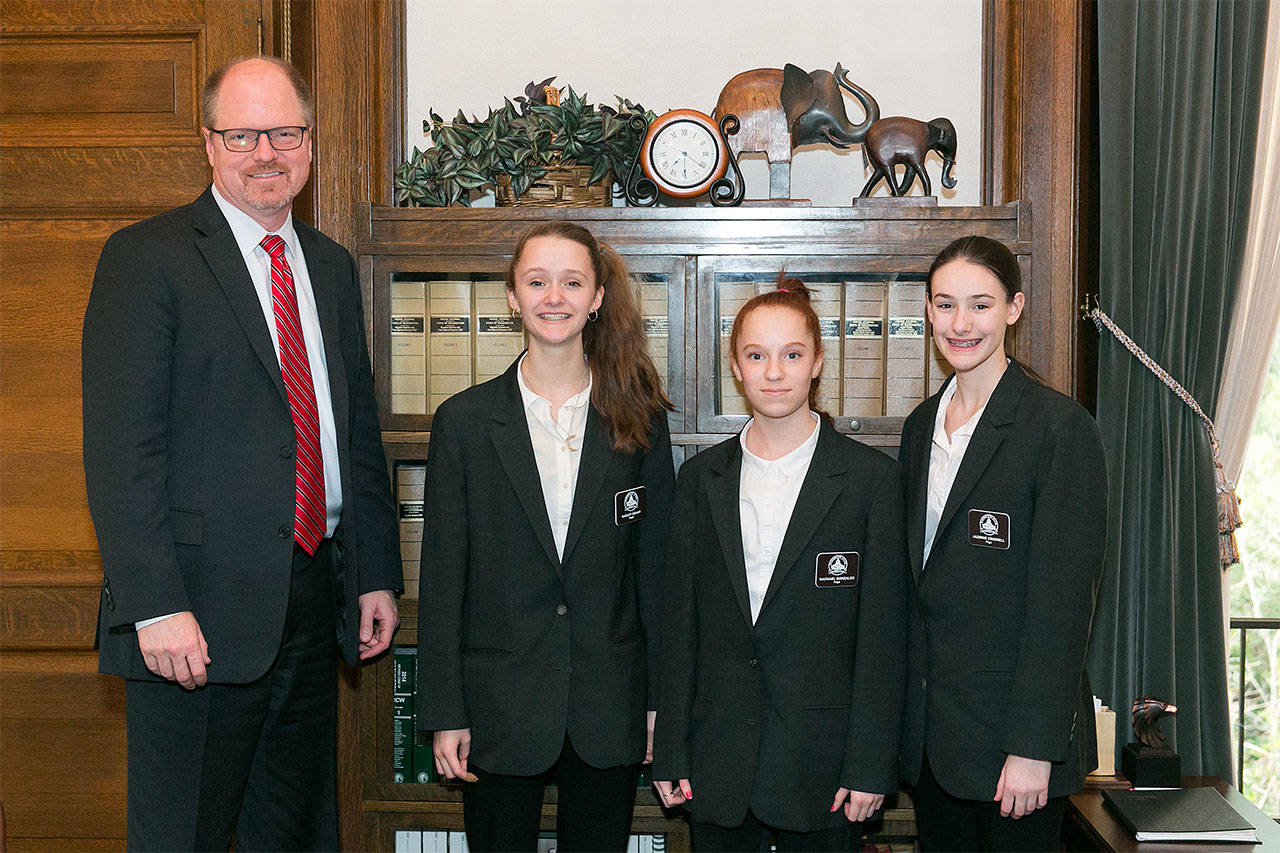 Rep. Dan Kristiansen, R-Snohomish, recently sponsored three legislative pages from Snohomish County. From left are Hadley Grant, Rachel Gonzales and Jazmine Criswell. (Contributed photo)