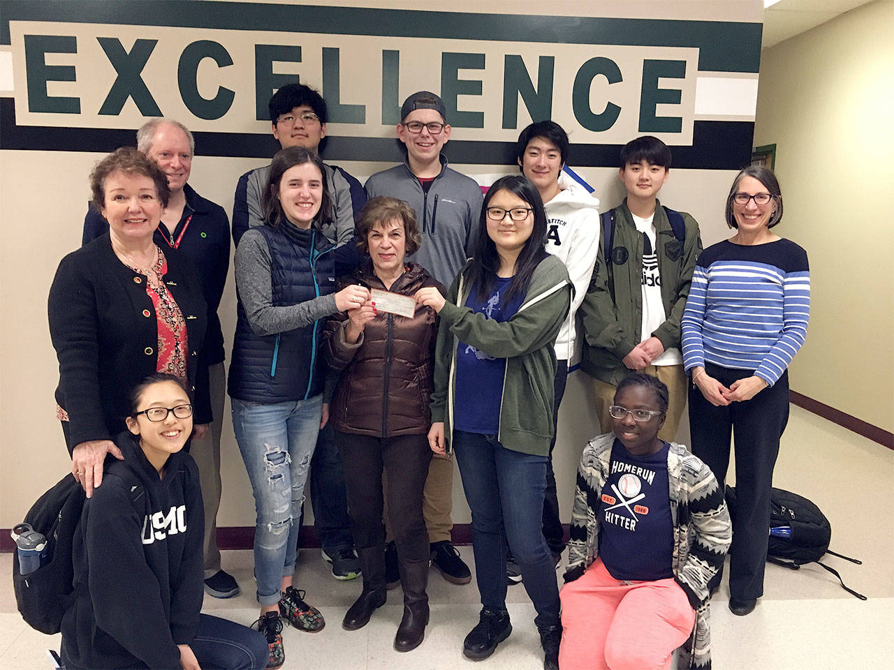 Mill Creek Garden Club awards a grant to the Project Green Club at Henry M. Jackson High School to help pay for an interpretive sign the students plan to design and place in their Native Garden. (Contributed photo)
