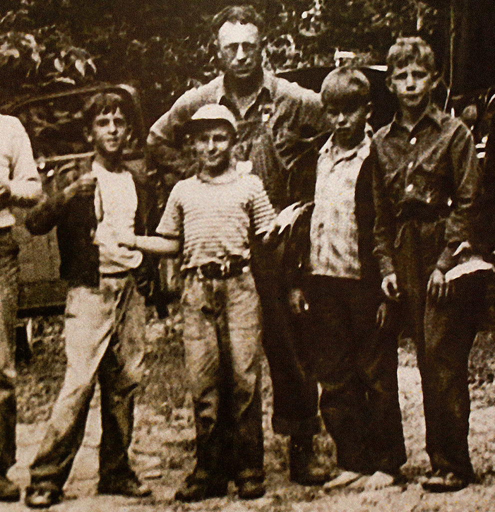 A young William Prochnau (left) holds a fish during a Cub Scouts outing in Darrington in the 1940s. Next (to the right,) is Fred Howard, then (in plaid) Larry O’Donnell, now an Everett historian. The taller boy, far right is Jerry Solie, and the adult is Larry’s father, Glenn O’Donnell.
