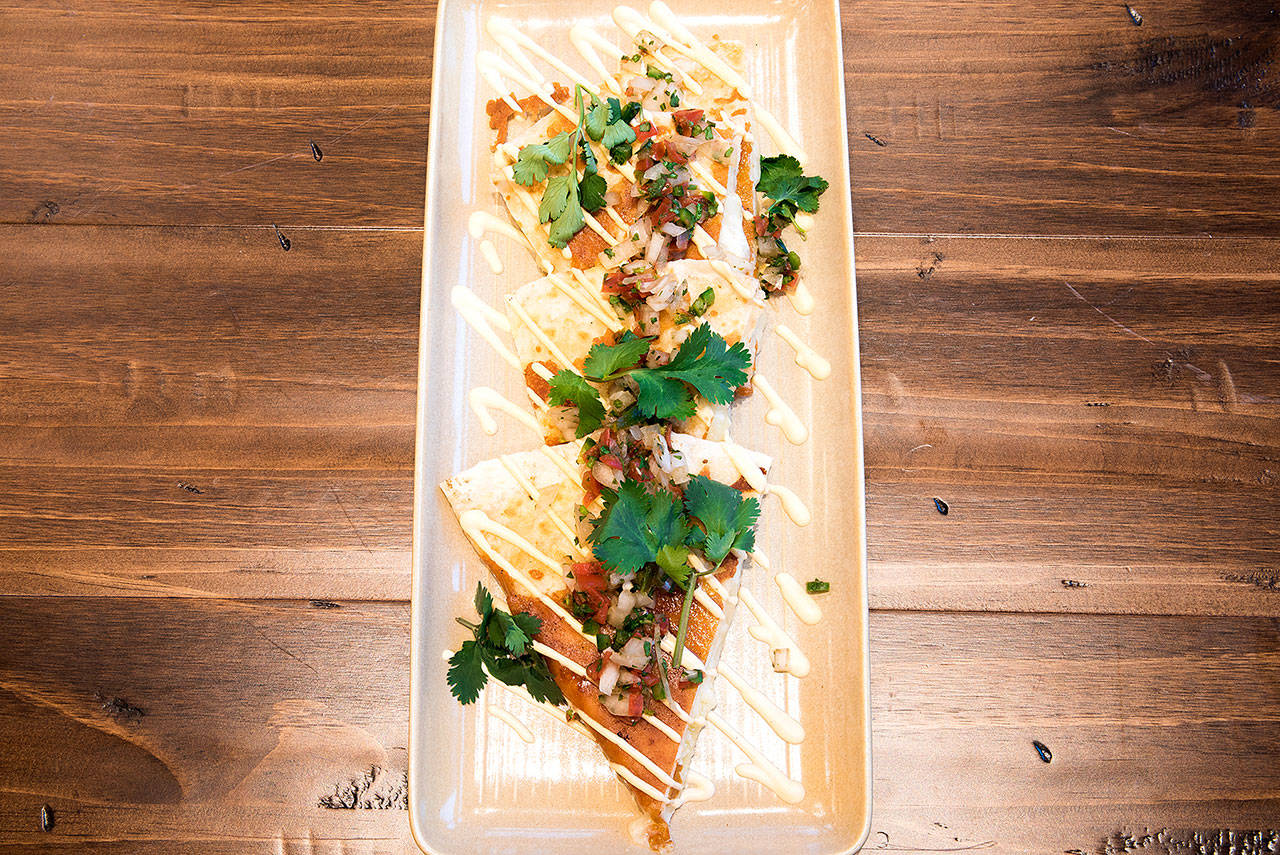 The crispy cheese quesadilla features a blend of Monterey and Asadero cheese in a flour tortilla griddled to a crisp. (Robert Winkle Photography)