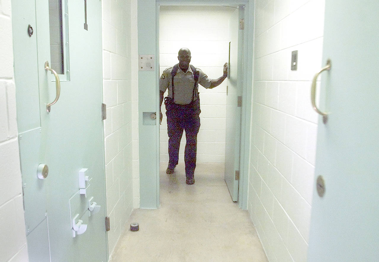 A Marysville Police Department custody officer stands in a hallway at the Marysville jail in 2002. (Herald file)                                A Marysville Police Department custody officer stands in a hallway at the Marysville jail. (Stephanie S. Cordle / Herald file)