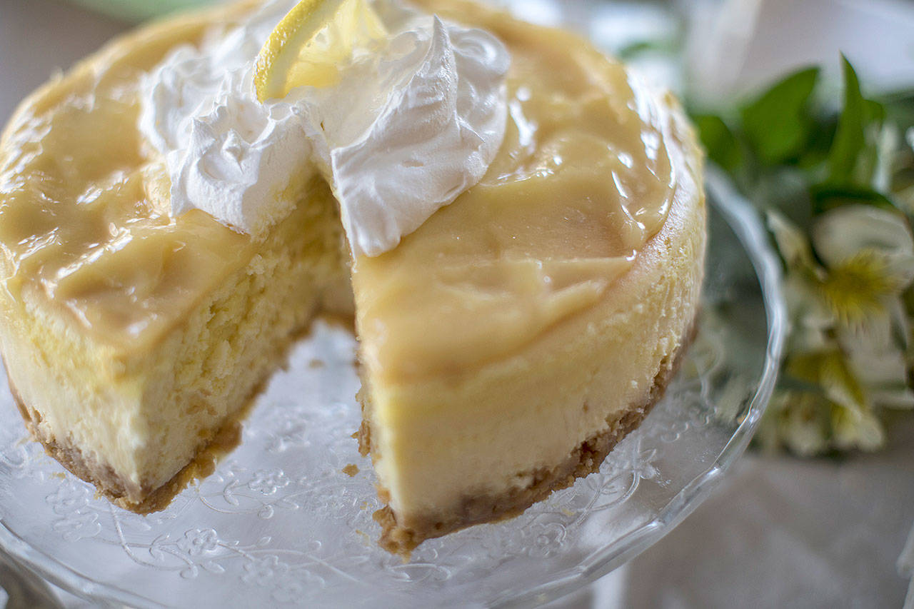 This lemon cheesecake has a crust made from sandwich cookies and a lemon curd topping. (Kathleen Galligan/Detroit Free Press)