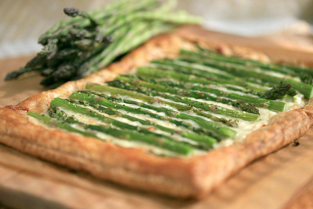 The asparagus fontina tart calls for 2 cups of fontina or gruyere cheese. (Jessica J. Trevino/Detroit Free Press)
