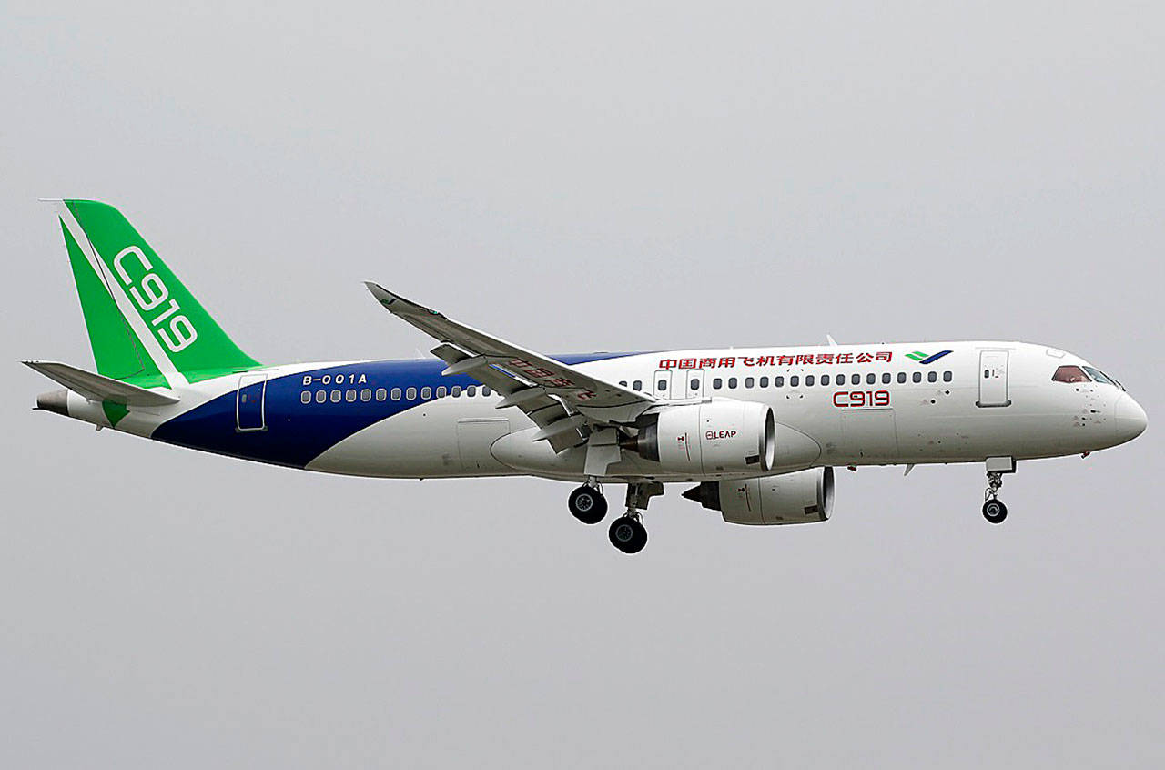 A Chinese-built Comac C919 is seen in flight at Pudong International Airport near Shanghai. (Wikipedia)