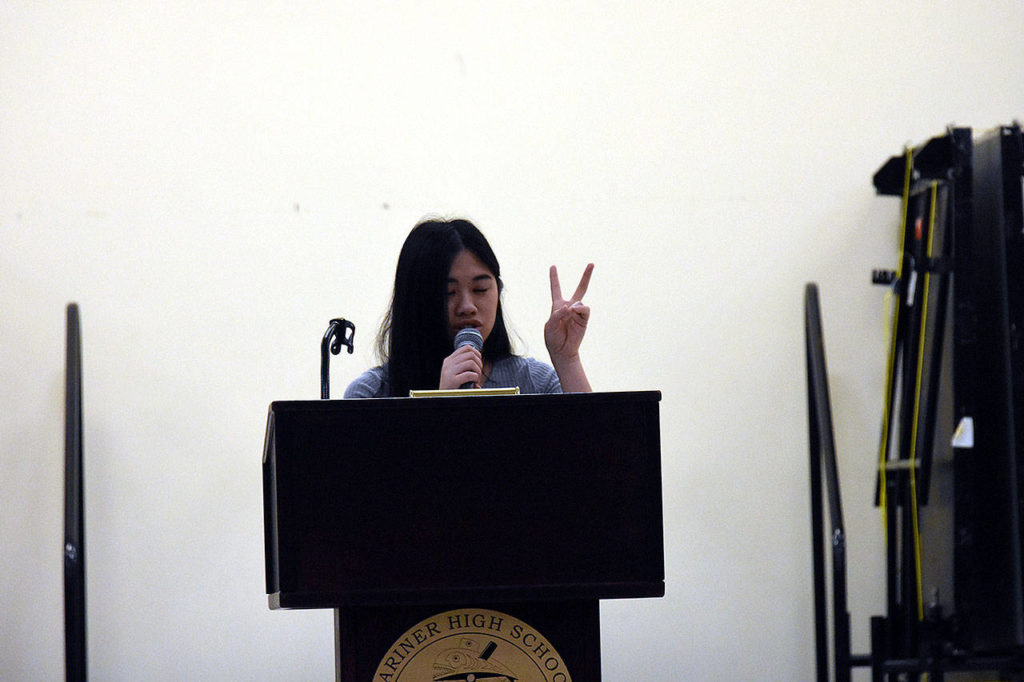 Eden Au Nguyen, 17, a senior at Marysville Getchell High School, said her community has been in mourning since a school shooting claimed five lives in October 2014. She spoke at a forum on gun violence Saturday south of Everett. (Caleb Hutton / The Herald)
