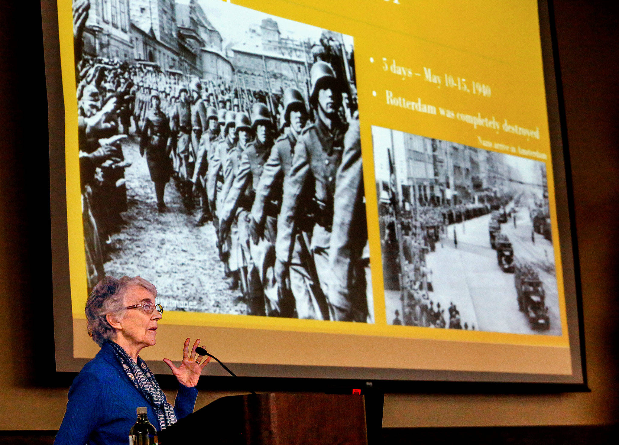 Ingrid Kanis Steppic, the first of four speakers in EvCC’s annual “Surviving the Holocaust” series, talks about her parents helping hide 40 Jews in The Netherlands during the Nazi occupation and her father warning others not to register but to hide. (Dan Bates / The Herald)