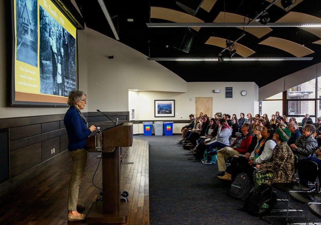 In EvCC’s Jackson Center Wilderness Room, Ingrid Steppic, who was born during Nazi occupation of The Netherlands, talks about her partents helping hide 40 Jews. Her father warned others not to register but to hide. (Dan Bates / The Herald)
