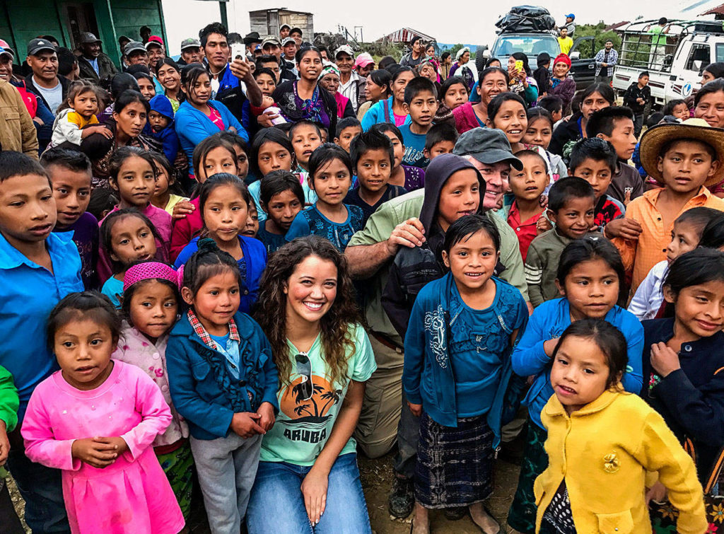 Kaitlyn Peterson (front center) and Buzz Rodland (cap) get in pictures with village kids in Guatemala. (Kelly Peterson photo)
