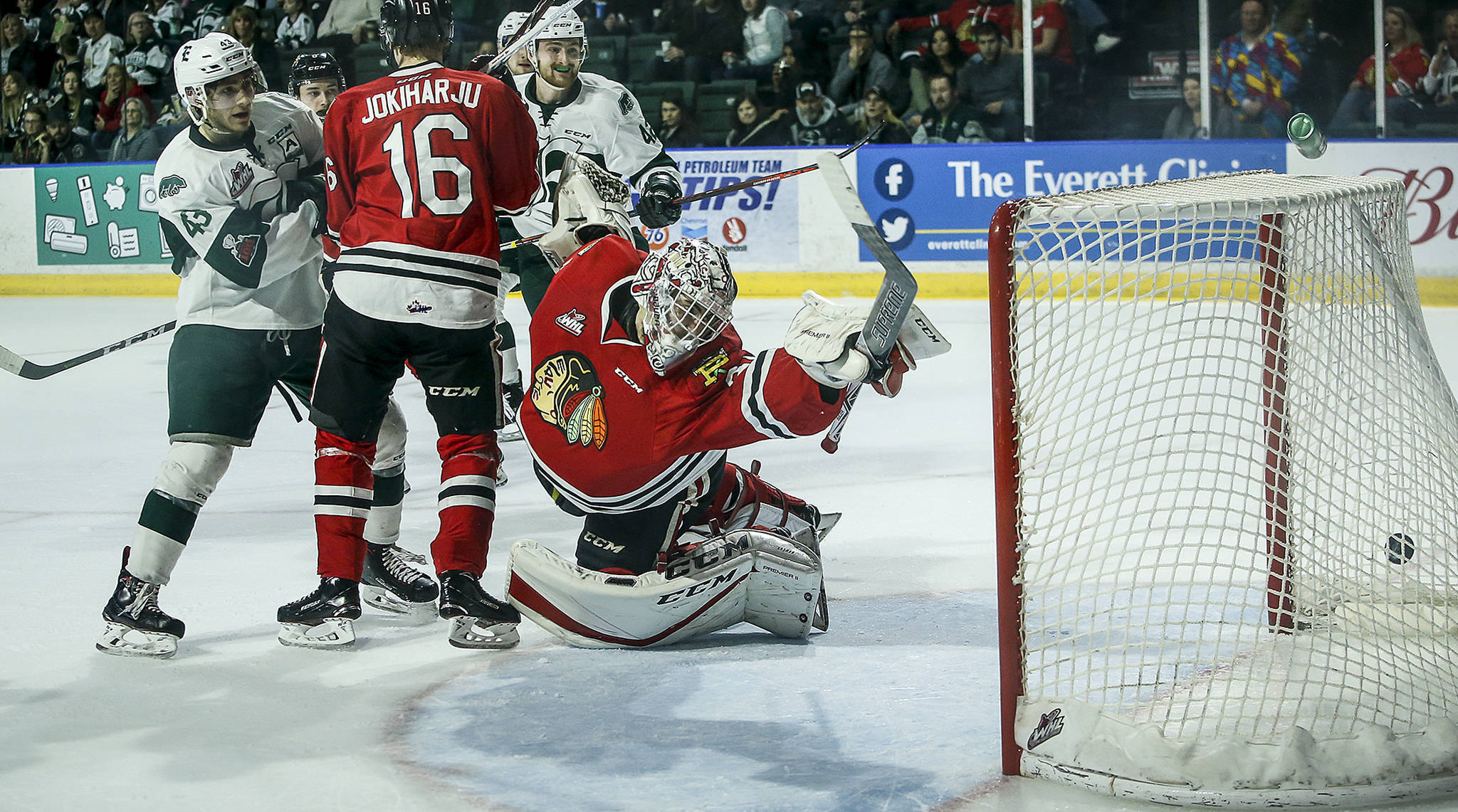 A shot by Silvertips forward Garrett Pilon (not pictured) flies past the outstretched glove of Portland goaltender Cole Kehler (center) for a goal in the second period of a second round playoff game at Angel of the Winds Arena in Everett on Saturday, April 7. (Ian Terry / The Herald)