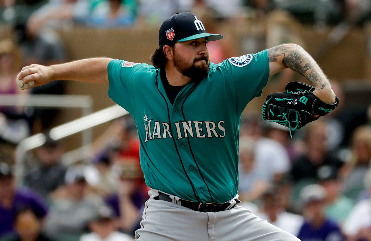 Seattle’s Rob Whalen throws against the Colorado Rockies in the first inning of a March 13 spring training game in Scottsdale, Ariz. (AP Photo/Chris Carlson)