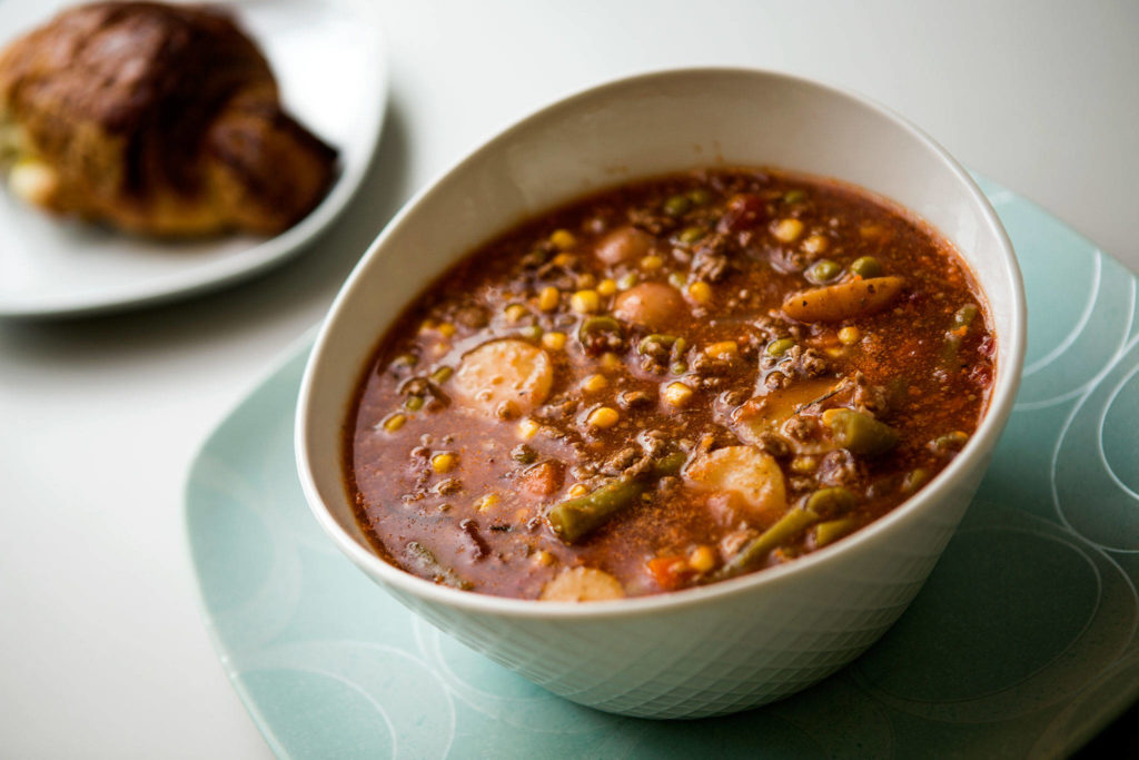 Hearty soup with green beans, peas, corn, ground beef, carrots, onions, beef broth, tomatoes and potatoes. Shot on Tuesday, April 10, 2018 in Everett, Wa. (Andy Bronson / The Herald)
