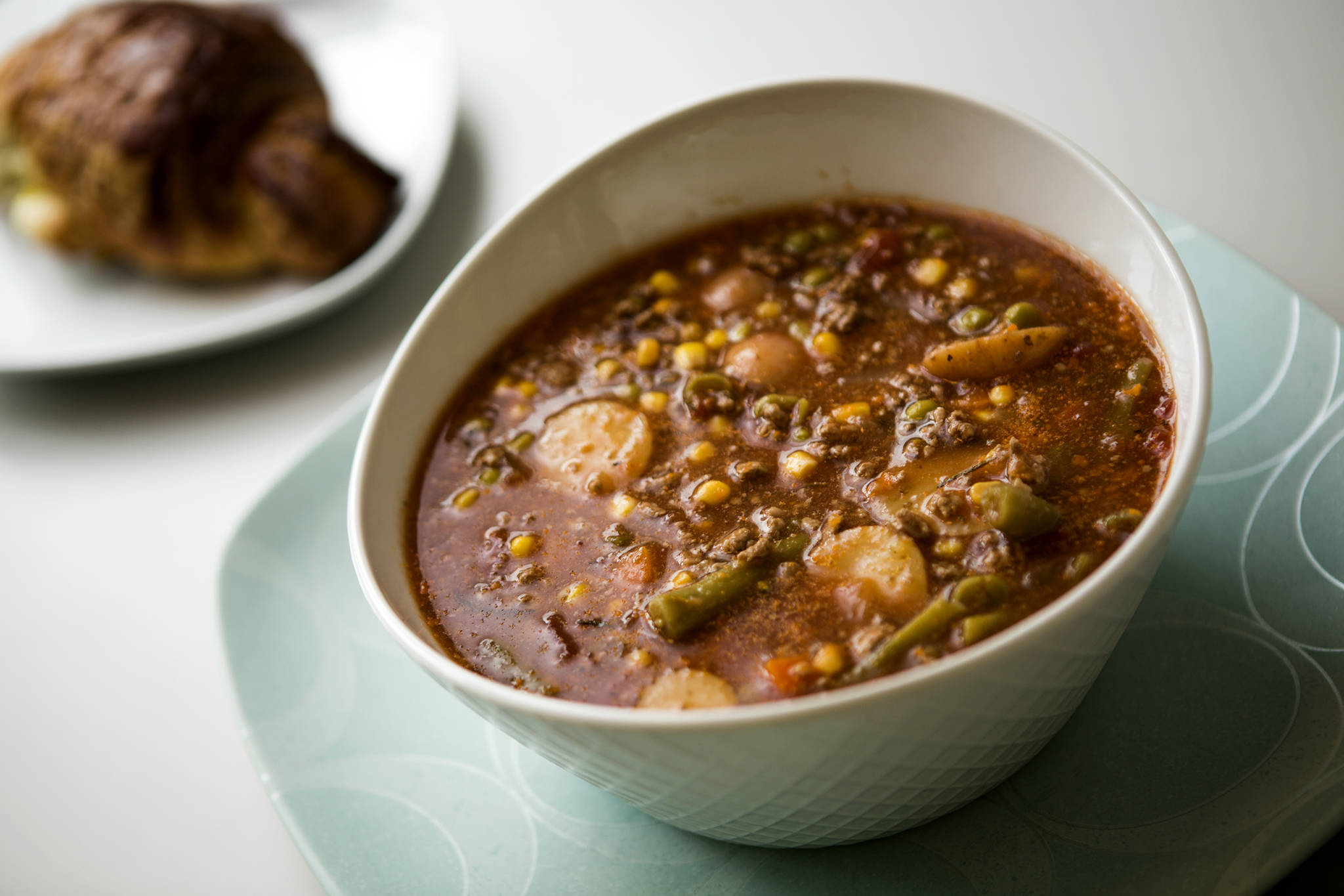 Andy Bronson / The Herald                                The author’s father makes no claims to being a gourmand, but he does whip up a hearty soup of green beans, peas, corn, ground beef, carrots, onions, beef broth, tomatoes and potatoes.
