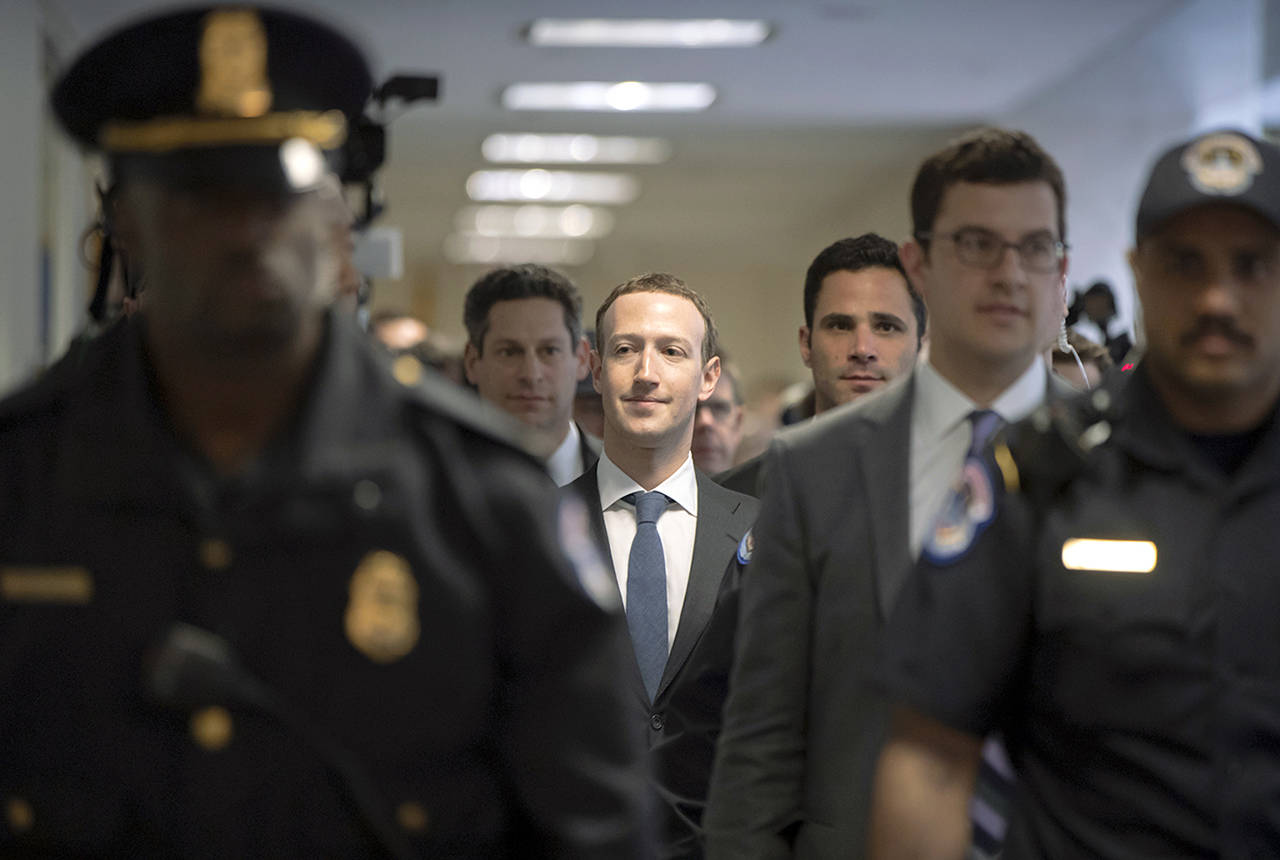 Facebook CEO Mark Zuckerberg arrives on Capitol Hill in Washington on Monday to meet with Sen. Dianne Feinstein, D-Calif., the ranking member of the Senate Judiciary Committee. Zuckerberg will testify Tuesday before a joint hearing of the Commerce and Judiciary Committees about the use of Facebook data to target American voters in the 2016 election. (AP Photo/J. Scott Applewhite)