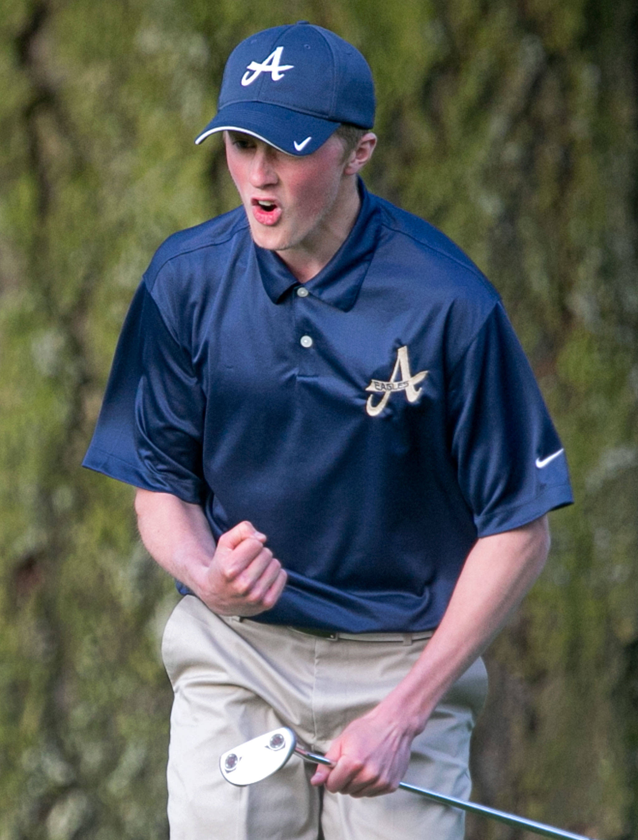 Arlington’s Cody Oakes celebrates a putt forcing another round of a sudden death playoff during the annual Tom Dolan Memorial Invitational at Everett Golf and Country Club Monday afternoon in Everett on April 9, 2018. (Kevin Clark / The Herald)