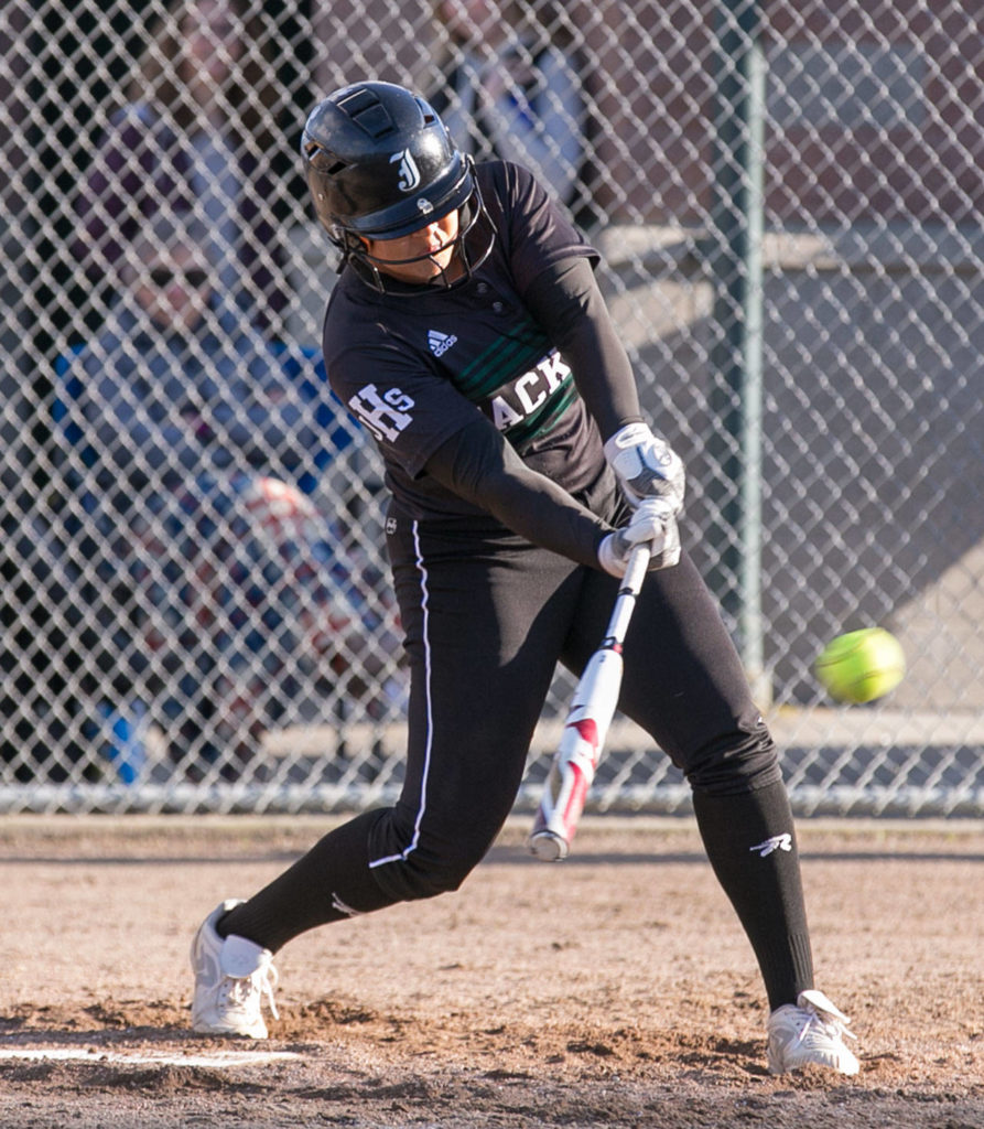 Jackson’s Iyanla Pennington drives in the game-winning runs against Lake Stevens on April 10, 2018, at Jackson High School in Mill Creek. (Kevin Clark / The Herald)
