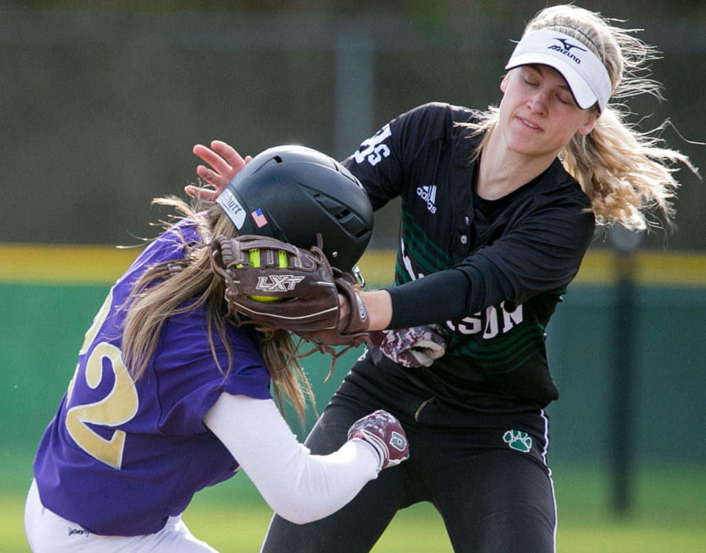 Jackson’s Kristina Day tags out Lake Stevens’ Anna Lucas during a game on April 10, 2018, at Jackson High School in Mill Creek. (Kevin Clark / The Herald)
