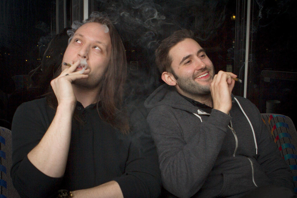 Tyler Smith (left) and Brent Flyberg smoke weed before returning to the stage to perform high at one of The Dope Show’s previous performances. (Danielle Mathias)
